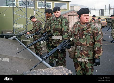 British Army soldiers unloading weapons in Belfast Army base during The ...