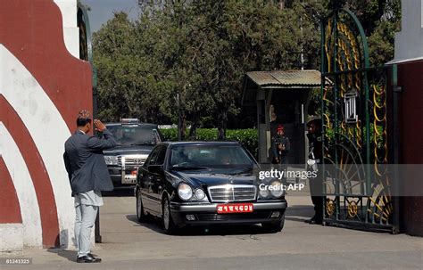 Nepal's King Gyanendra drives his car as he leaves the royal palace ...