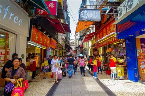 MACAU, CHINA- MAY 11, 2017: An unidentified people walking in the streets of Macau, located near ...