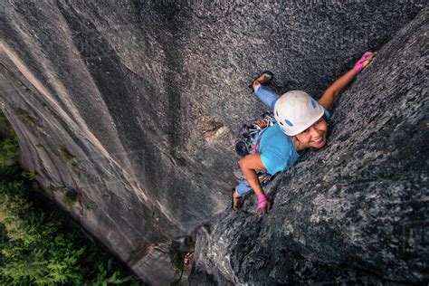 Woman rock climbing chief mountain, Squamish, Canada, high angle view - Stock Photo - Dissolve