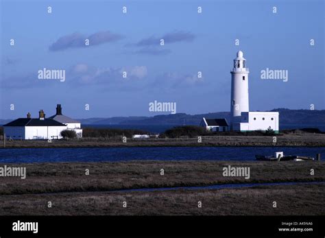 Lighthouse at Hurst Castle in the evening light Stock Photo - Alamy