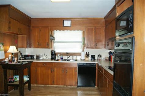 ranch house North Carolina - brown dated kitchen - built 1962 - Laurel Home