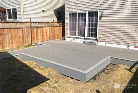 Ground-level Timbertech Terrain Composite Deck | Deck Builders