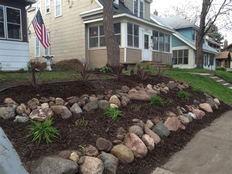 Rock Bed Retaining Wall I did. Great way to use up those large rocks on ...