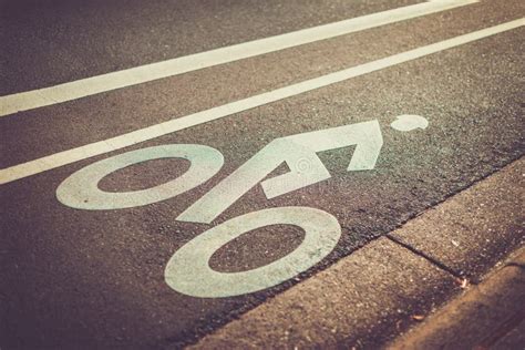 Bicycle sign on the road stock photo. Image of architecture - 162640320