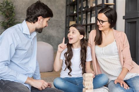 Premium Photo | Family playing jenga