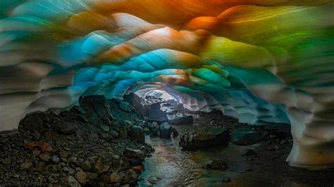 'Could not believe my eyes': Ice caves awash in vibrant colors as sun ...