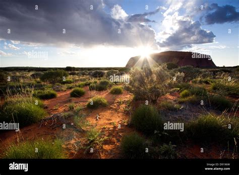 Ayres rock at sunrise Stock Photo - Alamy