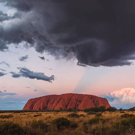 *🇦🇺 Storm clouds and soft light make for an eerie feeling at Uluru ...