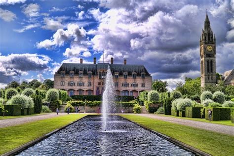 a large building with a fountain in front of it