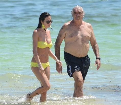 SwimSuitBox: Keeping her close! Flavio Briatore displays rounder tummy ...