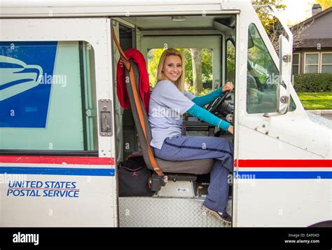 Female United States Postal Service carrier delivering mail in Stock Photo: 75318053 - Alamy