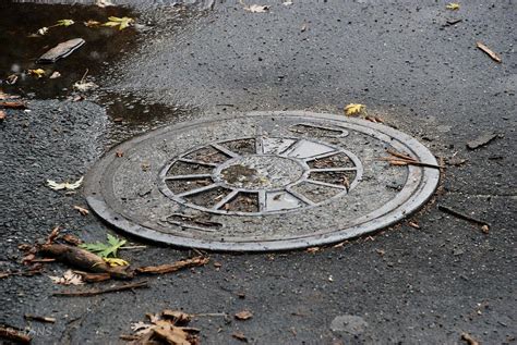 Sewer Cap Photograph by Rob Hans