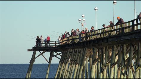 KURE BEACH, NORTH CAROLINA/USA - OCTOBER 19, 2014: Unidentified Anglers Fish From The Fishing ...