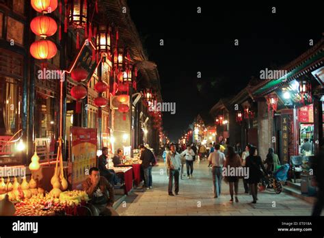 Bright night lights of the ancient Chinese city of Pingyao. China Stock Photo - Alamy