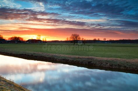 Beautiful Calm Sunset Over River in Farmland Stock Image - Image of netherlands, reflect: 30634559