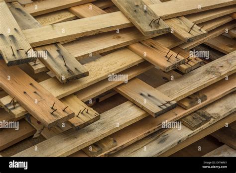 Broken wooden pallets on an industrial site Stock Photo - Alamy