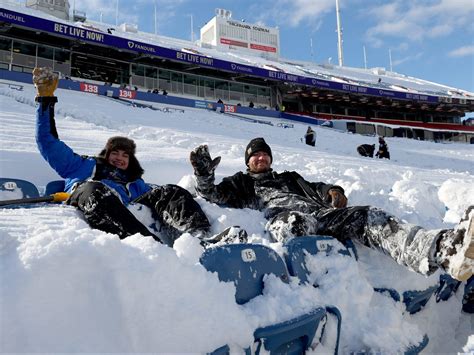 Bills Mafia braves snow, breaks tables before wild card playoff game ...