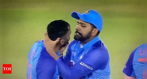 Social Humour: Rohit Sharma playfully grabbing Dinesh Karthik's face ...