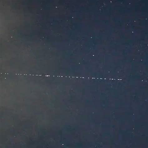 A train of SpaceX Starlink satellites seen travelling high over Japan ...