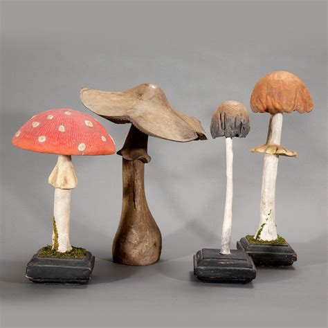 Three Painted Wood and Gesso Mushrooms; Together with a Carved Wood ...