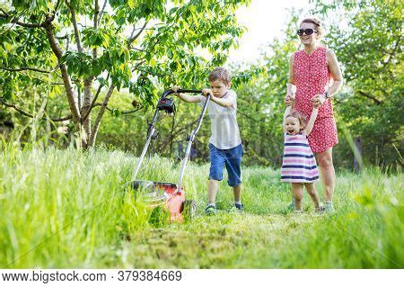 Young Boy Mowing Grass Image & Photo (Free Trial) | Bigstock