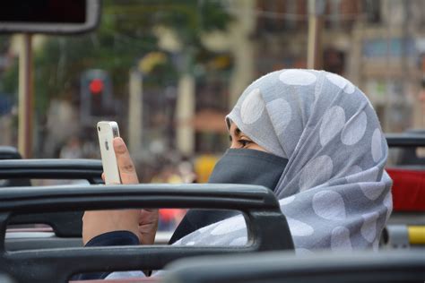 Free Images : iphone, apple, woman, window, driving, vehicle, sitting, mobile phone, islam ...