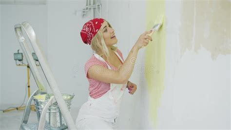 Happy Female Dipping Brush in Wall Paint Stock Video - Video of house, design: 120348515