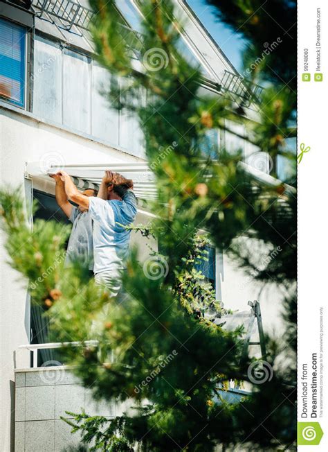 Team Installing Sun Protection Awning on Window Balckony Editorial Image - Image of marquee ...