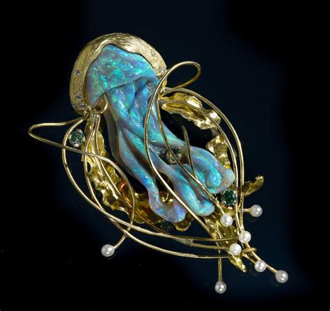 A short history: the delicate art of carved opal jewels | the jewelry loupe