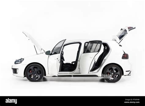 side view of new white car with open doors and open hood on white Stock Photo - Alamy