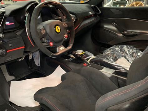 Interior of the Ferrari 488 Pista painted in Argento Nurburgring w/ the Pista Piloti livery and ...