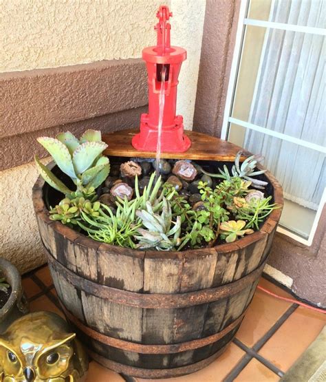 Pin by Miki Anne Eliza Fluker on Water Features | Wine barrel garden, Wine barrel planter ...