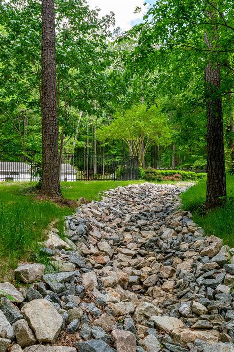 Raleigh Erosion Repair & Erosion Control: Pond Spillway - Dragonfly Pond Works | Blog | Erosion ...