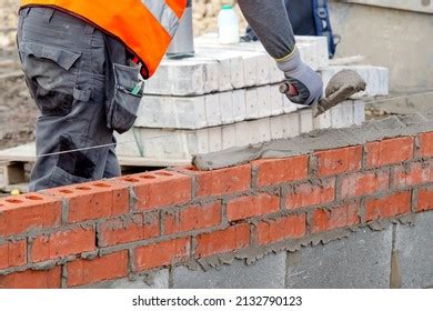 Bricklayer Laying Bricks On Mortar On Stock Photo 2132790123 | Shutterstock