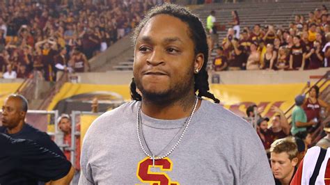 Ex-USC RB implies he was paid $150,000 in a duffel bag