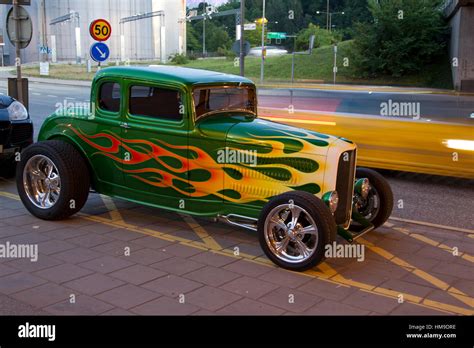 Very nice hot rod with flames on a street in Stockholm a nice evening ...