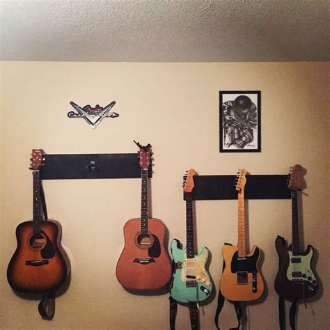 Guitar wall hangers. | Guitar wall hanger, Guitar wall, Wall hanger