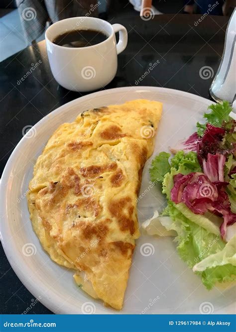 Omelette Served with Fresh Salad and Coffee for Breakfast at Restaurant. Stock Photo - Image of ...