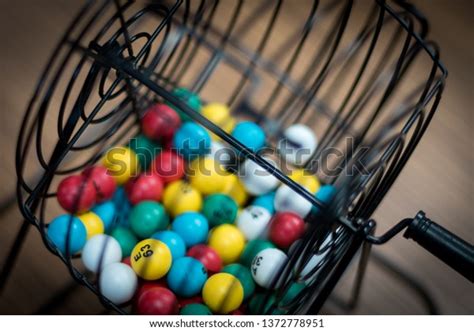 Multicolored Bingo Balls Cage Sitting On Stock Photo (Edit Now) 1372778951