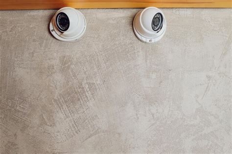 Premium Photo | Two security camera s on a wall