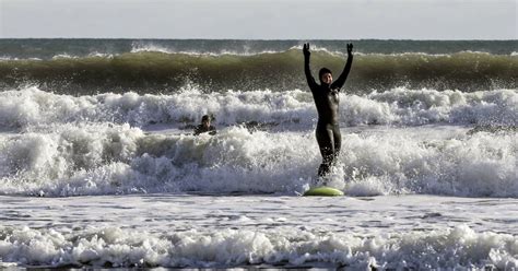 Tulsi Gabbard makes a splash — surfing in freezing New Hampshire