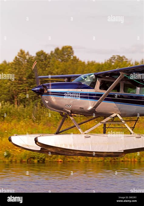 Cessna 206 float plane landing at lake Hood Seaplane Base in Anchorage Alaska Stock Photo - Alamy