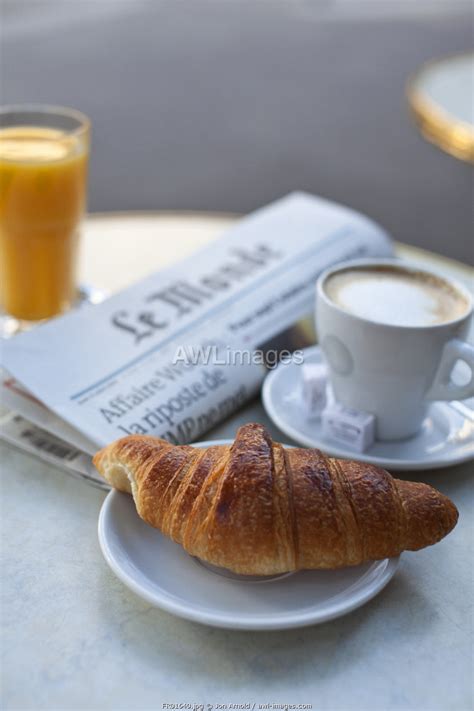 awl-images.com - France / Croissant and coffee in a cafe, Paris, France