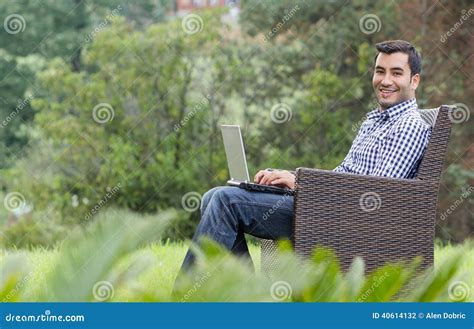 Smile Young Man with Laptop Stock Photo - Image of green, nature: 40614132