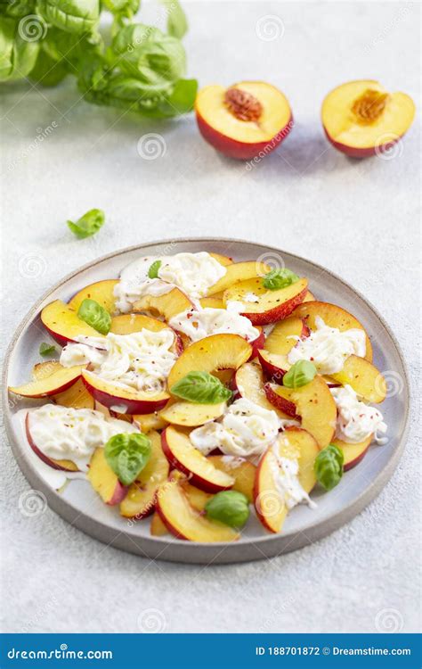 Fresh Salad with Peaches, Italian Stracciatella Cheese, Basil, Olive Oil and Honey. Stock Photo ...