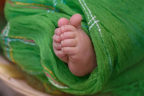 Premium Photo | Newborn baby feet photo of newborn baby feet soft focus