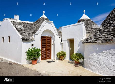 Alberobello, Italy, Puglia. Unique Trulli houses with conical roofs. Trullo, trulli, a ...