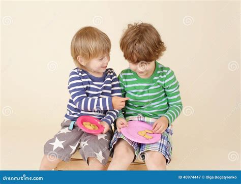 Kids Sharing a Snack, Food, Children S Fashion Stock Image - Image of sharing, boys: 40974447