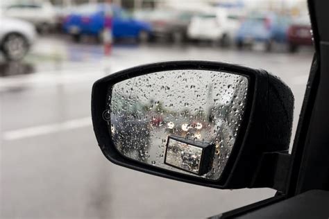 Wet by the Rain the Car Mirror, Blurry Cars in Mirror. Stock Image ...